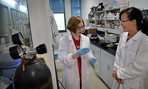 Chemical engineering major Olivia Gordon of Cary chats with her mentor in her Zhejiang University lab.