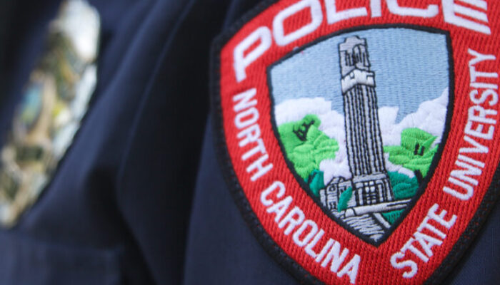 A closeup of a police badge that says "NCSU North Carolina State University"