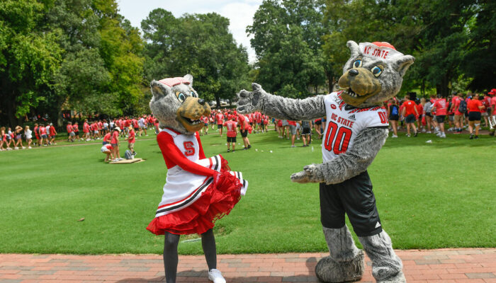 Wolfy gestures to students attending the Convocation at the Court of North Carolina