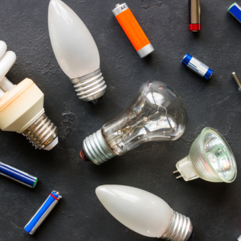 A photo of an assortment of universal waste. This includes lighters, light bulbs, batteries, etc.