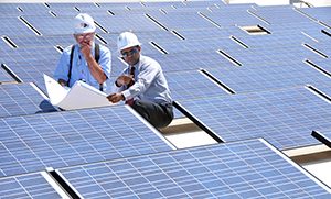 Solar panel experts discuss new solar field on the roof of the Keystone Science Center.